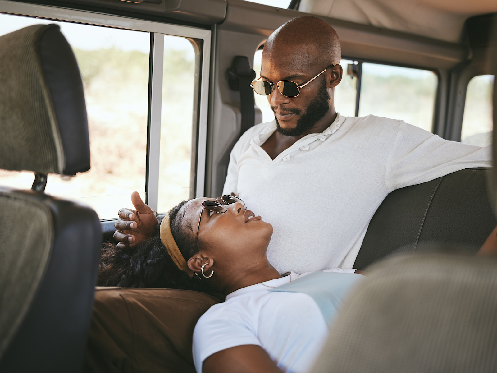 Couple, car and travel in nature for road trip, vacation or holiday while relax in van. Man, black by YuriArcursPeopleimages